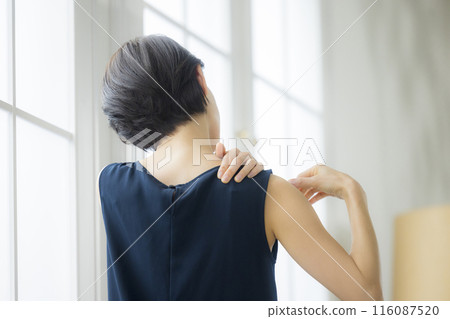 Middle-aged woman doing body care Middle-aged woman doing body care 116087520