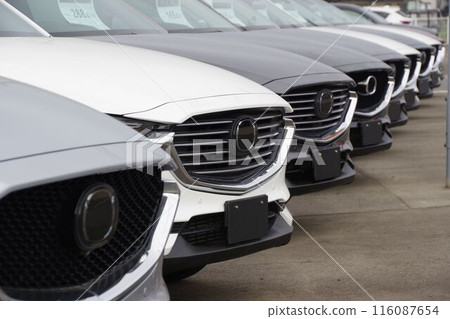 Used car image: Mazda cars lined up at a dealership 116087654