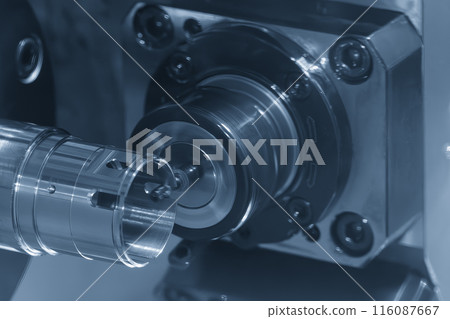 The multi-tasking CNC lathe machine milling the metal tube parts by milling spindle. 116087667