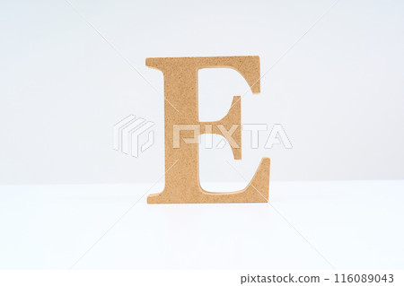 Wooden alphabet block with the letter "E" Wooden alphabet block with the letter "E" 116089043