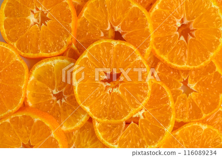 tangerine slices as a background for food photo 116089234