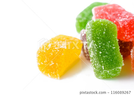 Multi-layered multicolored jelly marmalade of square shape. White background. Close-up Multi-layered multicolored jelly marmalade of square shape. White background. Close-up 116089267