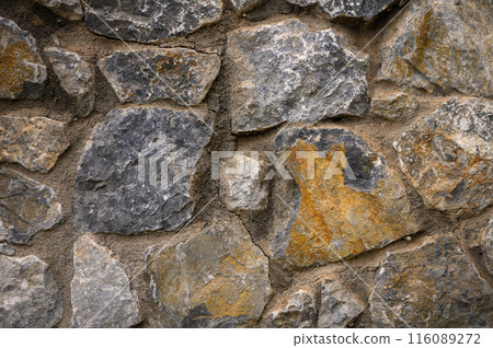 Stone wall as a background or texture. Part of a stone wall, for background or texture 1 116089272