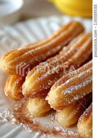 Freshly Baked Churros with Sugar and Cinnamon 116089588