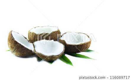 A close-up photograph of a mature and open coconuts isolated on a white background. A close-up photograph of a mature and open coconuts isolated on a white background. 116089717