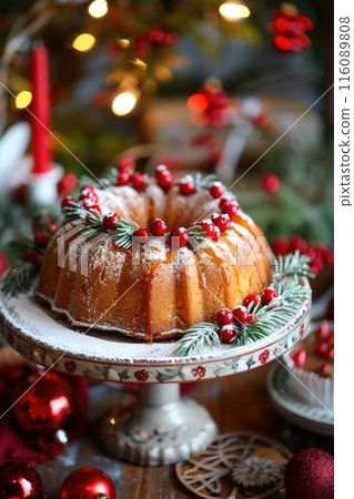 Festive Holiday Bundt Cake Decoration with Berries and Christmas Ornaments 116089808