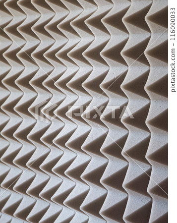 Grey Acoustic Foam. Close-up of sound-absorbing foam with pyramid shapes. Grey Acoustic Foam. Close-up of sound-absorbing foam with pyramid shapes. 116090033