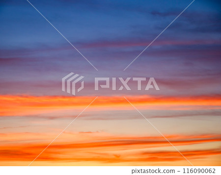 A tranquil evening sky showcasing a gradient of colors; a backdrop for meditation or mindfulness practices. 116090062