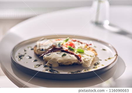 Potato pancakes with white garlic sauce. Healthy breakfast in the restaurant. With space to copy. High quality photo Potato pancakes with white garlic sauce. Healthy breakfast in the restaurant. With space to copy. High quality photo 116090083