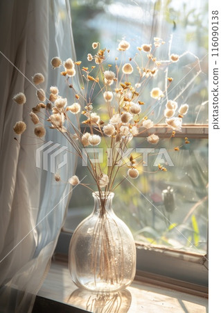 Sunlit Vintage Glass Vase with Dried Flowers by Window 116090138