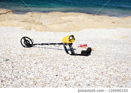 Metal detector on the beach. Metal detector on the beach. 116090183