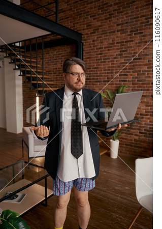Funny businessman in formal suit and underwear giving self presentation online Funny businessman in formal suit and underwear giving self presentation online 116090617