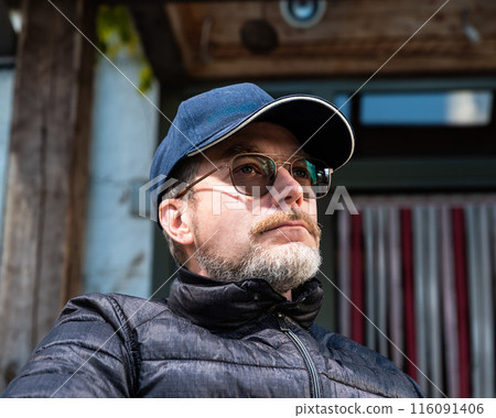Casual outdoor portrait of a 48 yo white man wearing glasses and a beard, Borchtlombeek, Belgium Casual outdoor portrait of a 48 yo white man wearing glasses and a beard, Borchtlombeek, Belgium 116091406