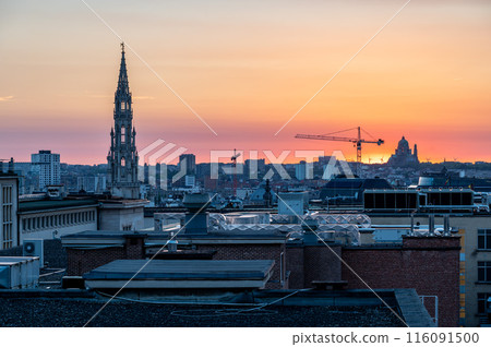 Brussels Old Town, Belgium - Golden hour cityscape with the town hall tower and rooftops 116091500