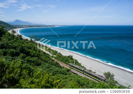 Taiwan Railway Administration EMU900 train runs through Taimali on the South-Link Line with the ocean as a backdrop 116091650