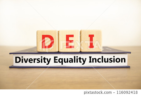 DEI diversity equality inclusion symbol. Concept words DEI diversity equality inclusion on blocks and book. Beautiful white background. Business DEI diversity equality inclusion concept. Copy space. 116092418
