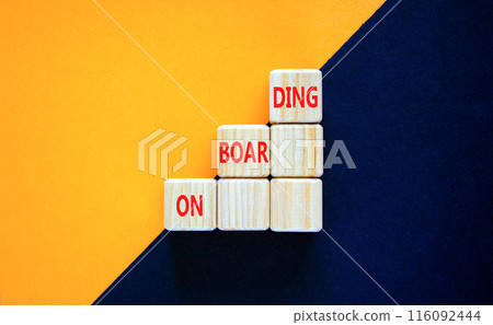 Onboarding success symbol. Concept word Onboarding on beautiful wooden cubes. Beautiful orange black background. Business onboarding success concept. Copy space. 116092444
