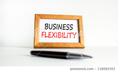 Business flexibility symbol. Concept words Business flexibility on beautiful wooden picture frame. Beautiful white paper background. Black pen. Business flexibility concept. Copy space. 116092501