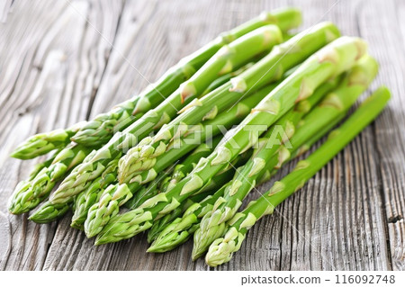 Vegetables. Green asparagus on the table. 116092748