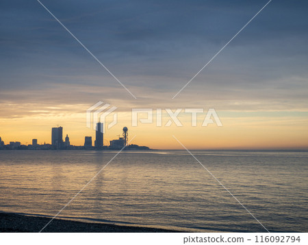 View of the sea modern city. Batumi from afar. Tall houses on the sea. Beautiful landscape.  Batumi at sunset 116092794