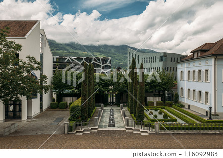 Surrounded by greenery, the Liechtenstein courtyard harmoniously combines modern and historic architectural elements Surrounded by greenery, the Liechtenstein courtyard harmoniously combines modern and historic architectural elements 116092983