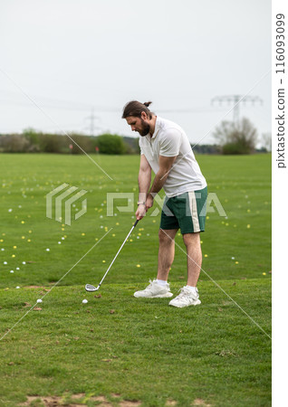 Man with golf ball on lawn for game enjoying match and competition on golfing course Man with golf ball on lawn for game enjoying match and competition on golfing course 116093099