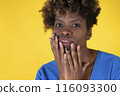 Woman Covers Her Mouth With Her Hands 116093300