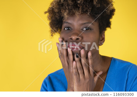 Woman Covers Her Mouth With Her Hands Woman Covers Her Mouth With Her Hands 116093300