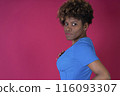 Woman in Blue Shirt Posing for Picture 116093307
