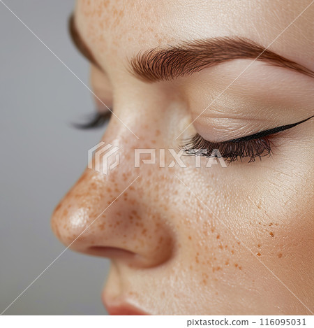 Freckled Close Up of Perfectly Groomed Eyebrows and Eyeliner for Beauty and Makeup. Freckled Close Up of Perfectly Groomed Eyebrows and Eyeliner for Beauty and Makeup. 116095031
