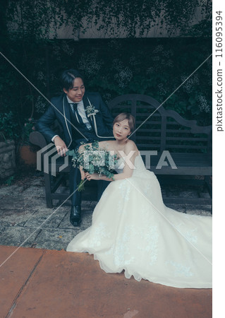 Bride and groom in tuxedo and wedding dress Bride and groom in tuxedo and wedding dress 116095394