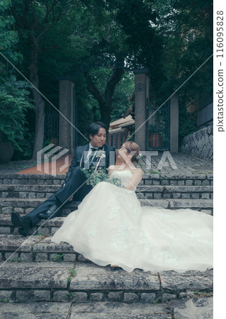 Bride and groom in tuxedo and wedding dress Bride and groom in tuxedo and wedding dress 116095828
