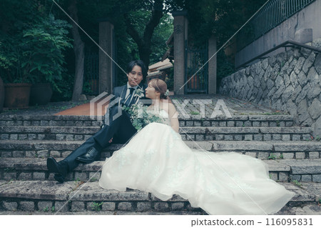 Bride and groom in tuxedo and wedding dress Bride and groom in tuxedo and wedding dress 116095831