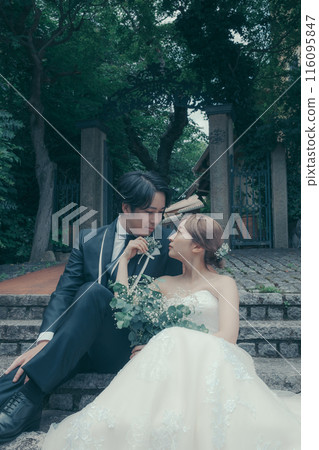 Bride and groom in tuxedo and wedding dress Bride and groom in tuxedo and wedding dress 116095847