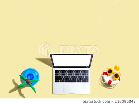 Laptop computer with summer theme items Laptop computer with summer theme items 116096842