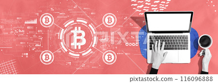 Bitcoin theme with person using a laptop Bitcoin theme with person using a laptop 116096888