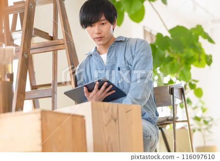 Man doing interior construction work Man doing interior construction work 116097610