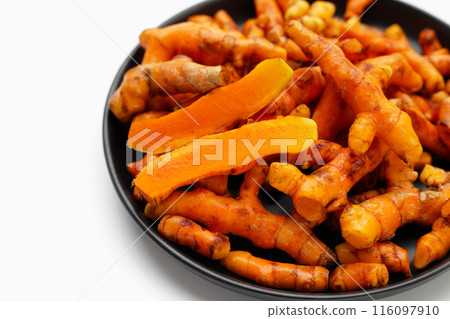 Turmeric roots on white background. Turmeric roots on white background. 116097910