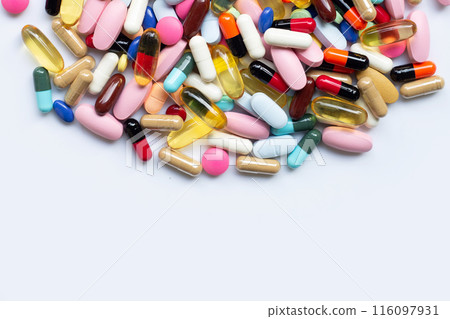 Colorful tablets with capsules and pills on white. 116097931