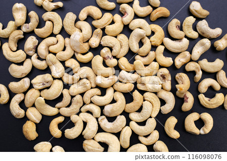 Cashew nuts on dark background. 116098076