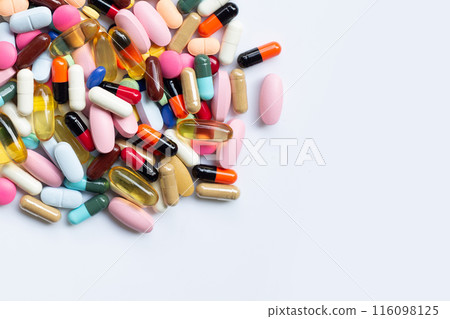 Colorful tablets with capsules and pills on white. 116098125