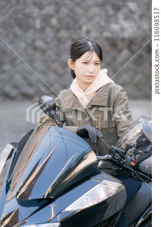 Woman riding a bike Woman riding a bike 116098517