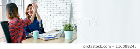 Banner Happy success business woman partner meeting working together in company office. Panoramic picture of Meeting Executive Asian business woman office desk with fist arm raised executive teamwork Banner Happy success business woman partner meeting working together in company office. Panoramic picture of Meeting Executive Asian business woman office desk with fist arm raised executive teamwork 116099243