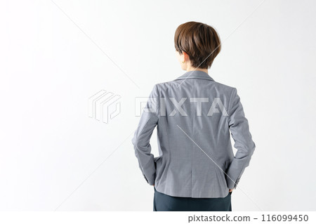 Rear view of a woman wearing a jacket Rear view of a woman wearing a jacket 116099450