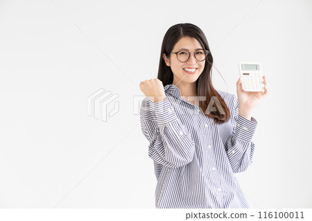Smiling woman with calculator Smiling woman with calculator 116100011