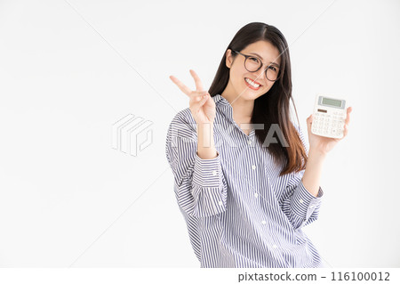Smiling woman with calculator 116100012