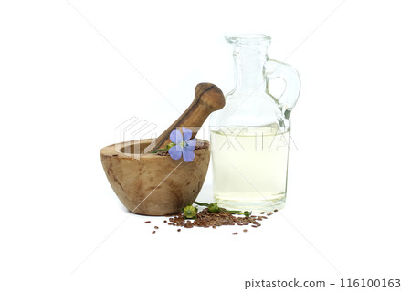 Linseed and linseed oil in glass decanter on white Linseed and linseed oil in glass decanter on white 116100163