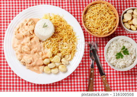 Homemade chicken stroganoff in ceramic plate on red checkered tablecloth Homemade chicken stroganoff in ceramic plate on red checkered tablecloth 116100508