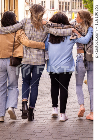 A group of friends joyfully exploring the urban setting, bonding and having fun on a beautiful day 116100855