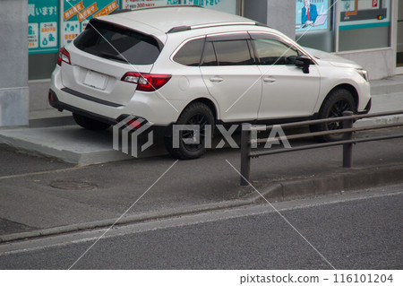 Cars parked on the sidewalk 116101204